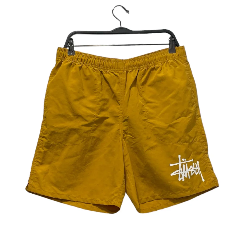 Men's ripped denim shorts for a trendy streetwear aestheticSTUSSY/Shorts/M/Nylon/CML/LEG LOGO